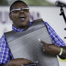 Musician playing at the Southwest Louisiana Zydeco Music Festival in Opelousas, Louisiana