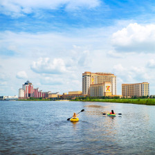 Kayakers passing the Golden Nugget Lake Charles and L’auberge Casino Resort in Louisiana